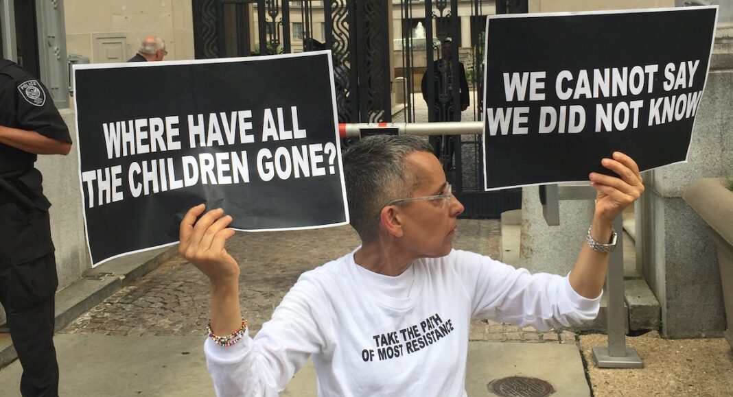 A protestor denounces the family separation policy.
