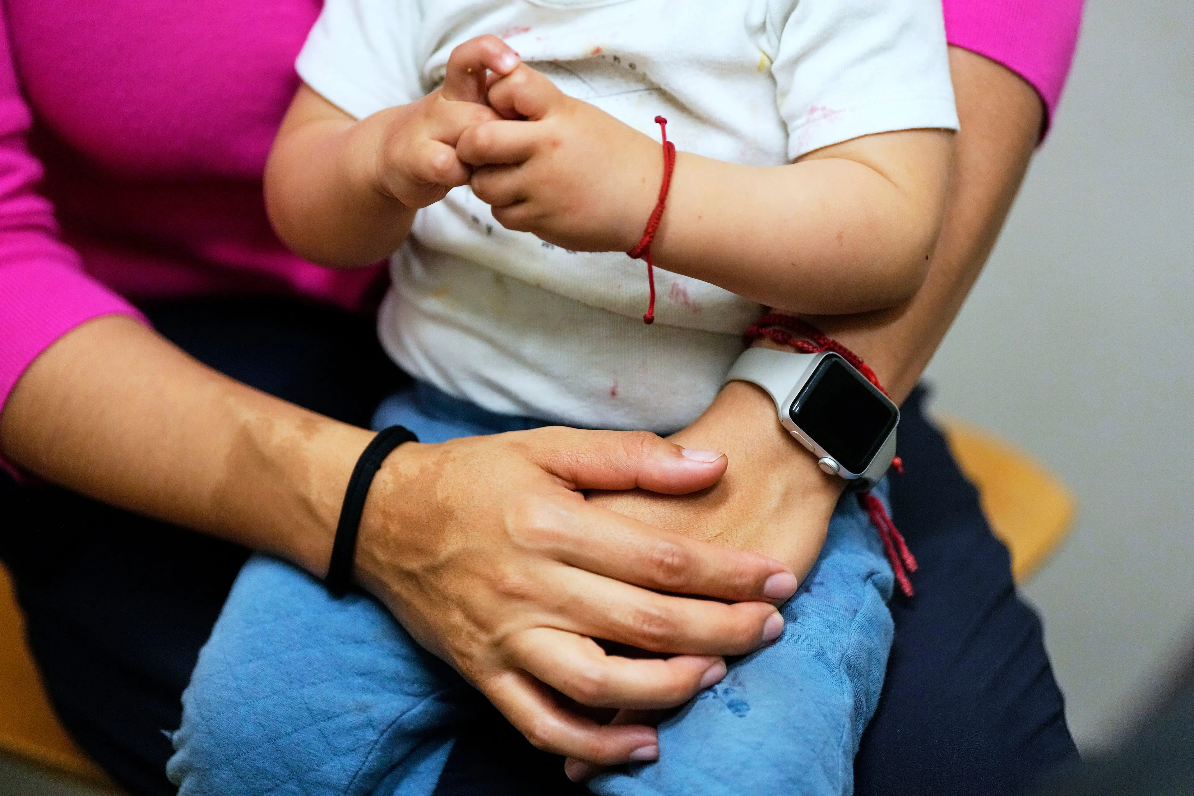 A woman and her 16-month-old son wait to see a doctor at a CommuniCare+OLE clinic in Davis, California, on June 26.(AP PHOTO/GODOFREDO A. VÁSQUEZ/Creative Commons license for single use)