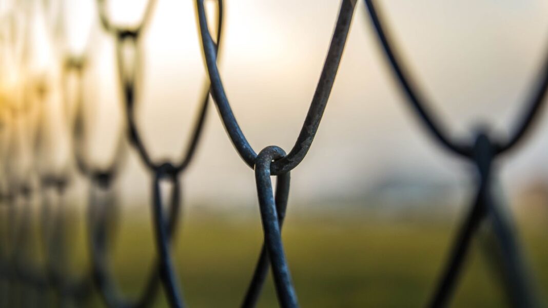 Chain Link Foggy Sunset
