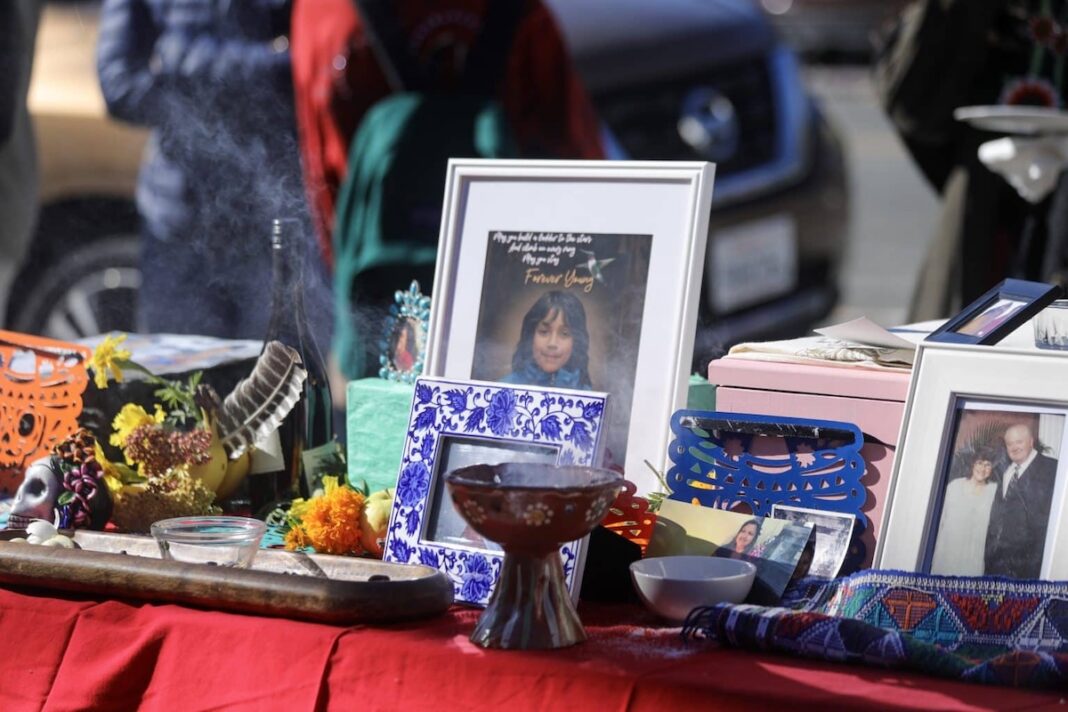 An ofrenda, or alter, is an essential part of Día de los Muertos. Pictures of departed loved ones are accompanied by their favorite treats to honor loss and bring them back home. Photo by Brenda Gonzalez