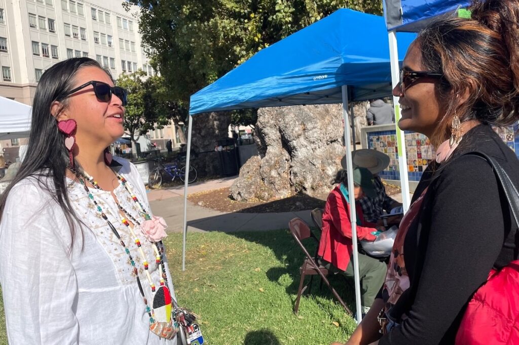 Marie Hernandez (L), Hoopa Valley Nation, coordinator for Berkeley’s annual Indigenous People’s Day Powwow and Indian Market.